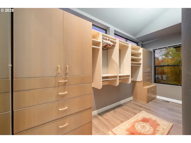 a bathroom with a bathtub a sink and a large mirror