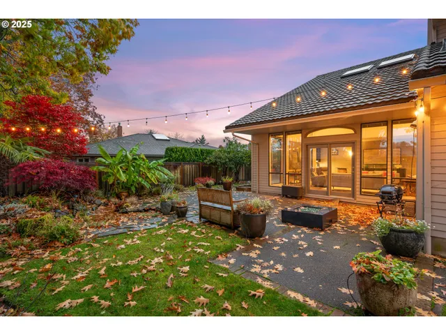 a view of a patio with table and chairs and potted plants