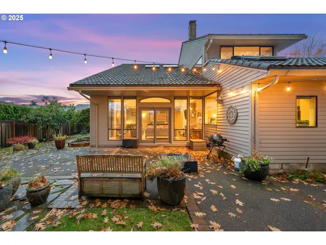 a view of a backyard with sitting area