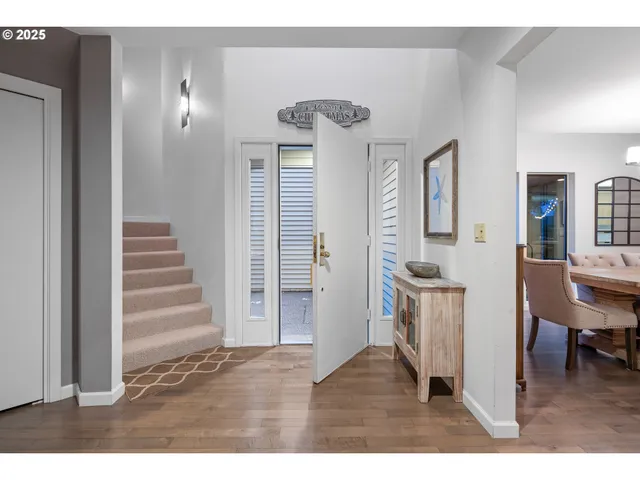 a view of a livingroom with furniture and stairs