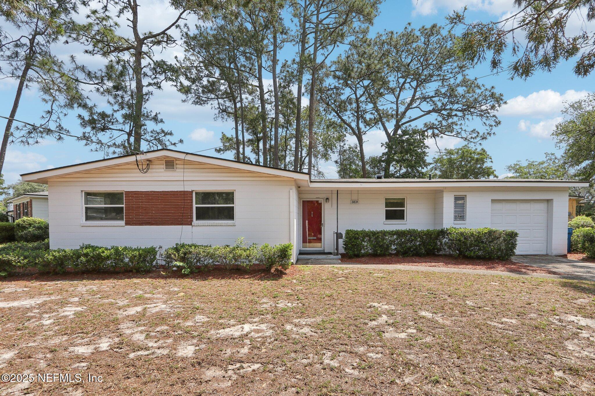 3831 Rogero Road Jacksonville, FL 32277 - Photo 1 of 33 a view of a house with a yard