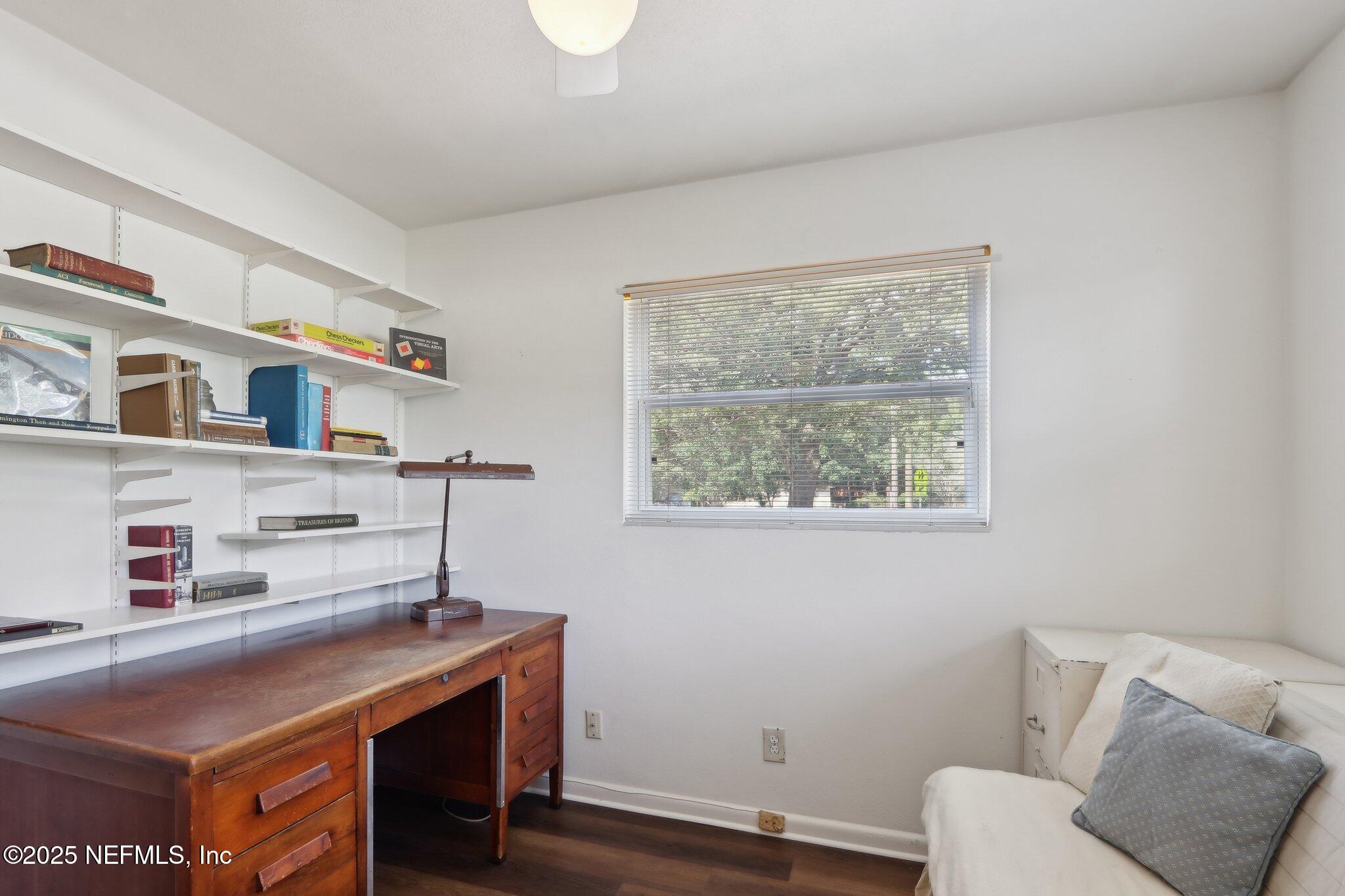 3831 Rogero Road Jacksonville, FL 32277 - Photo 19 of 33 a room with furniture and a window