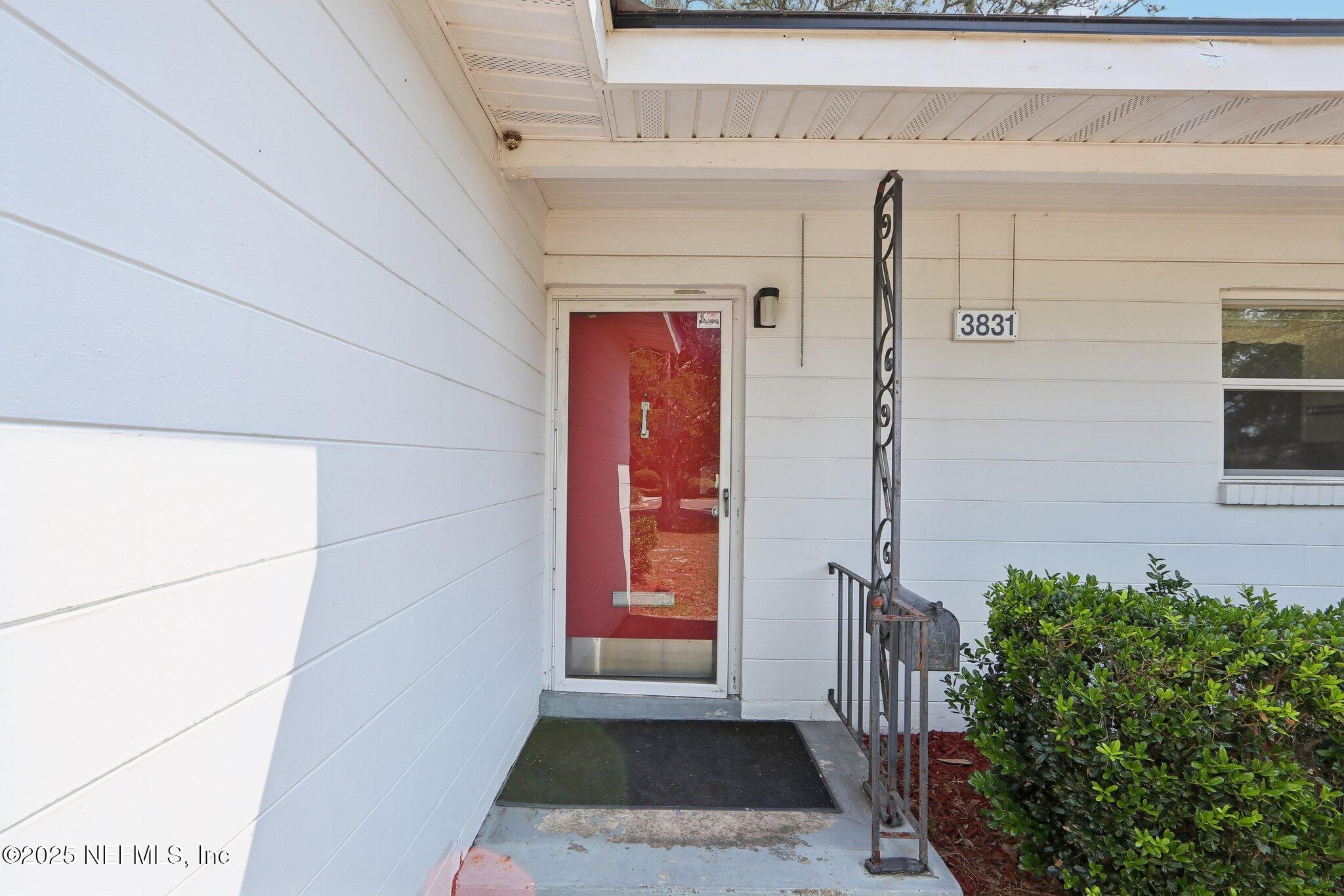 3831 Rogero Road Jacksonville, FL 32277 - Photo 2 of 33 a view of a entryway door of the house