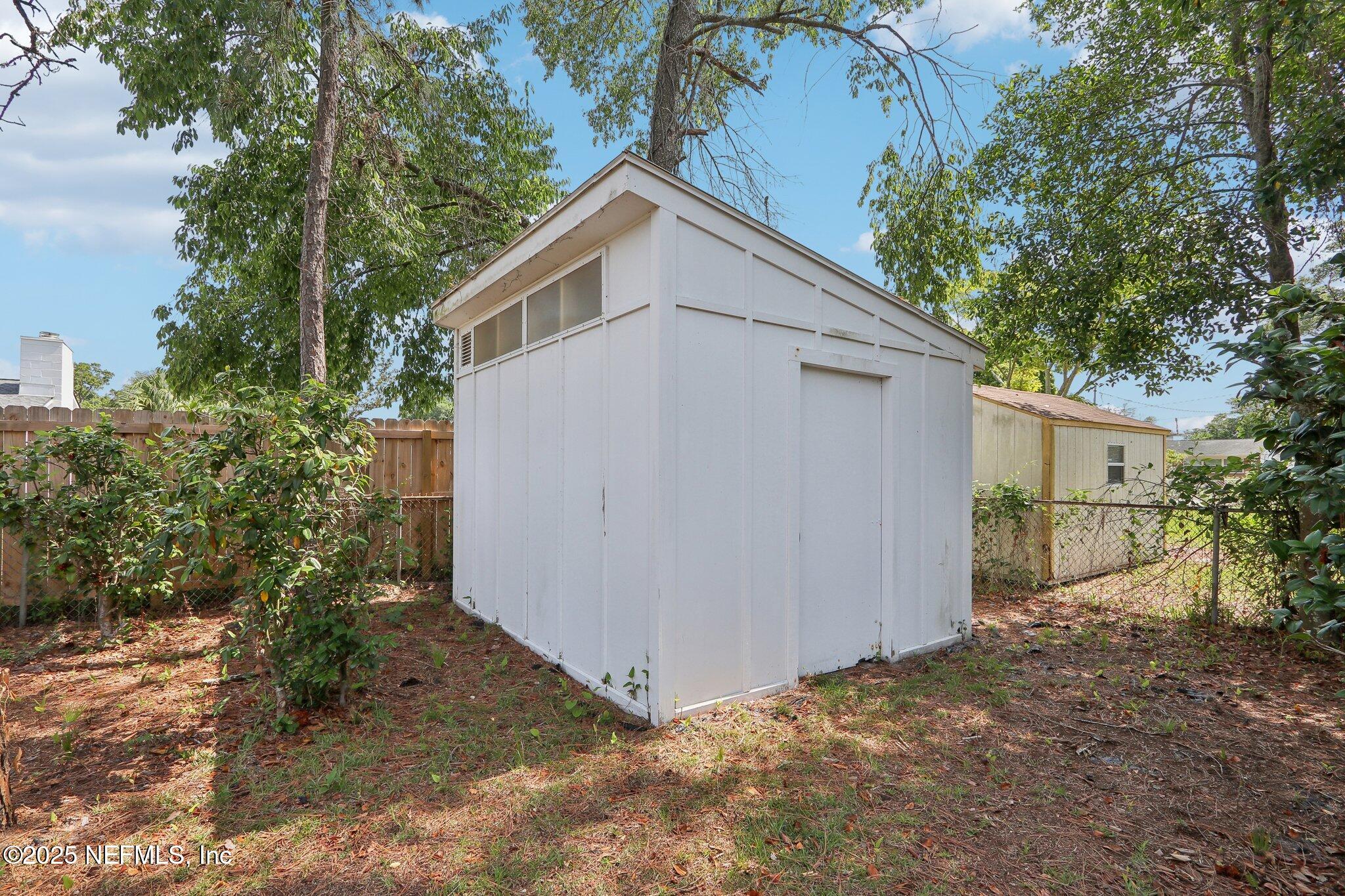 3831 Rogero Road Jacksonville, FL 32277 - Photo 28 of 33 a view of a house with a yard