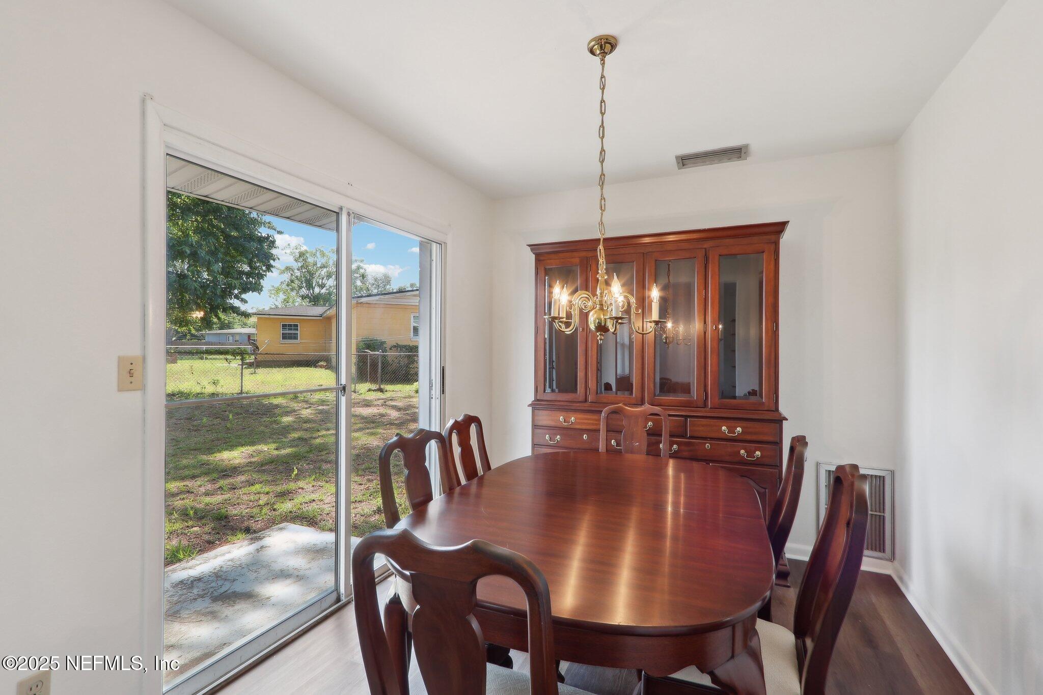 3831 Rogero Road Jacksonville, FL 32277 - Photo 6 of 33 a view of a dining room with furniture window and outside view