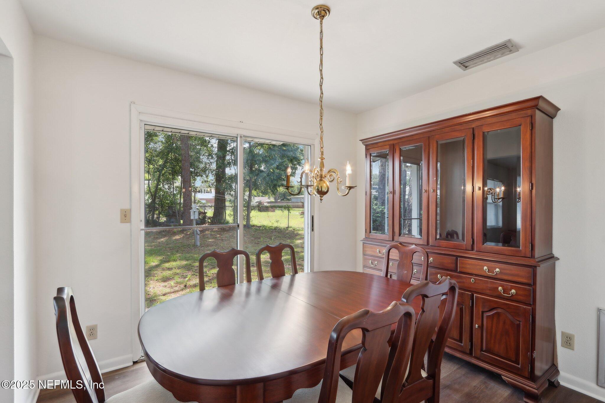 3831 Rogero Road Jacksonville, FL 32277 - Photo 8 of 33 a view of a dining room with furniture window and outside view
