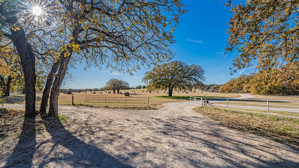 7550 Goodman Lane Azle, TX 76020 - Photo 11 of 19 a view of a yard with large trees