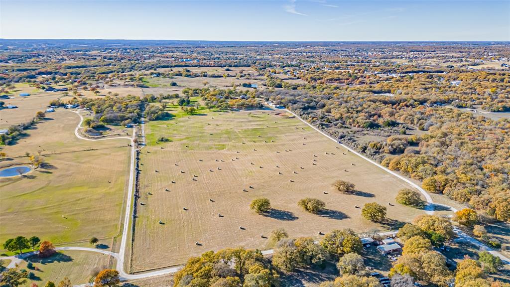 7550 Goodman Lane Azle, TX 76020 - Photo 2 of 19 an aerial view of residential houses with outdoor space