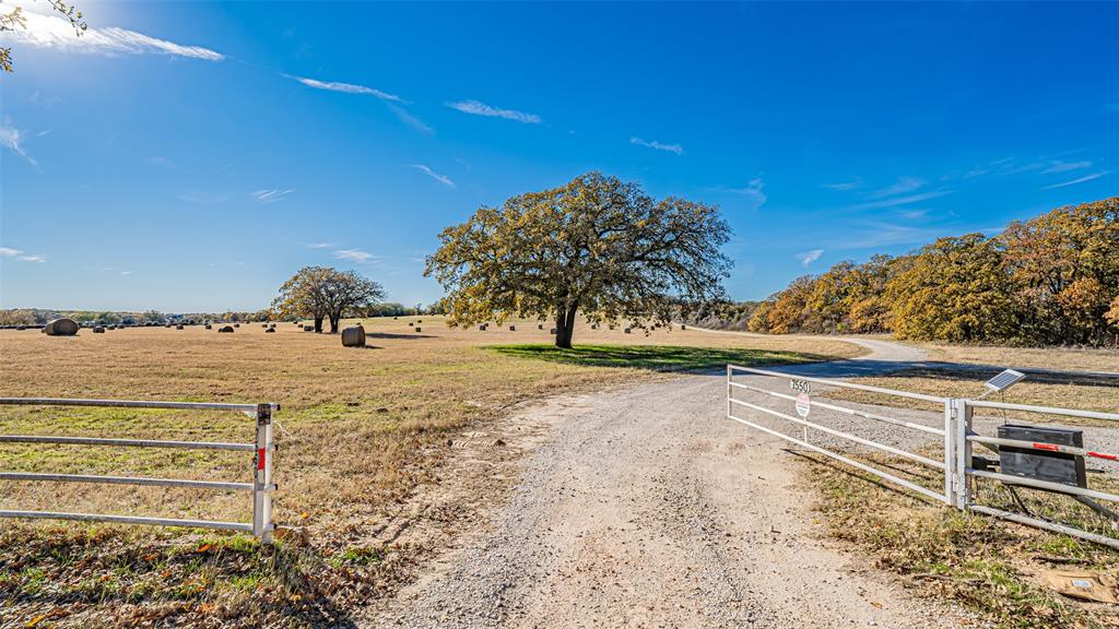 7550 Goodman Lane Azle, TX 76020 - Photo 10 of 19 a view of a parking space with large trees