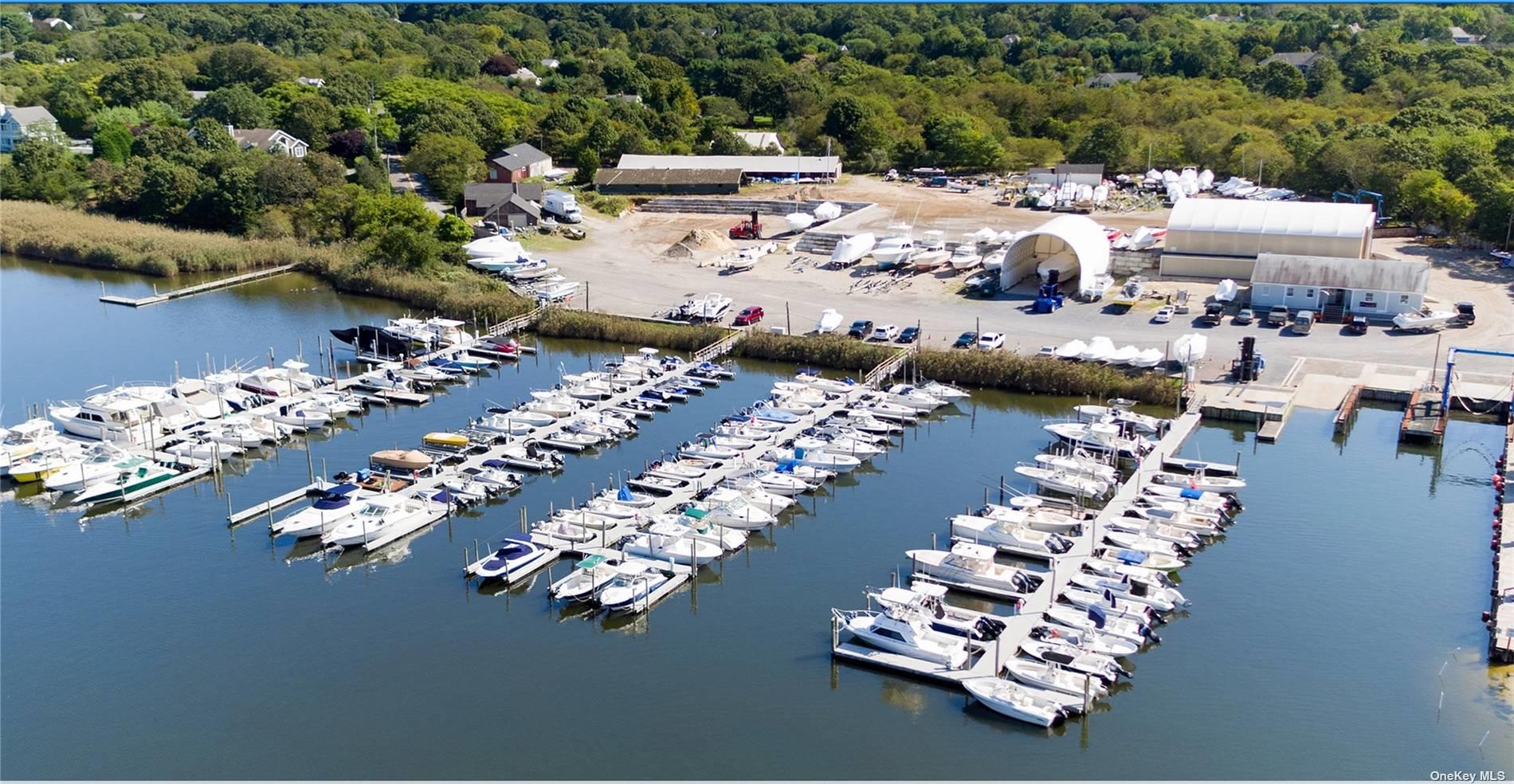 42 Dock Road Remsenburg, NY 11960 - Photo 1 of 2 a picture of a lake with outdoor seating