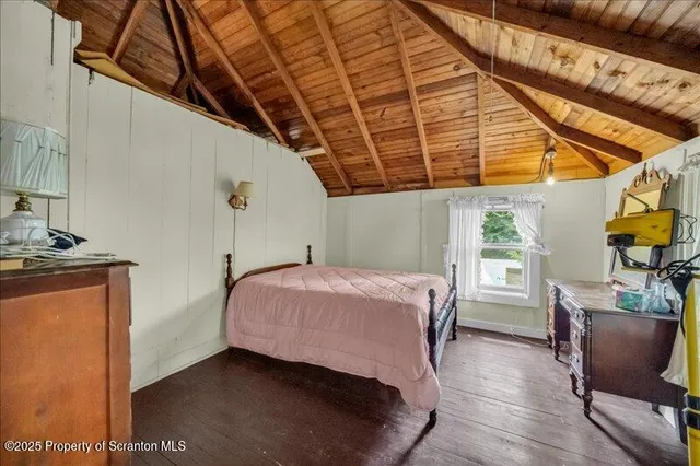 a bed room with a bed and furniture