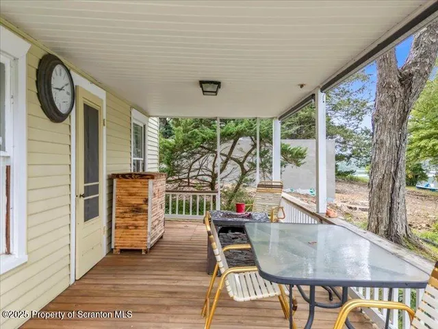 a dining room with furniture and a window