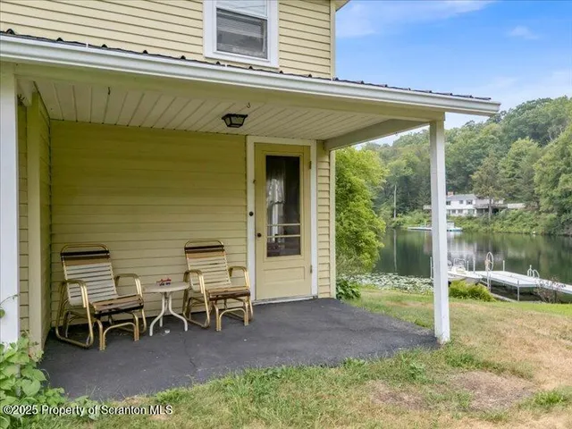 a view of a two chairs in the balcony