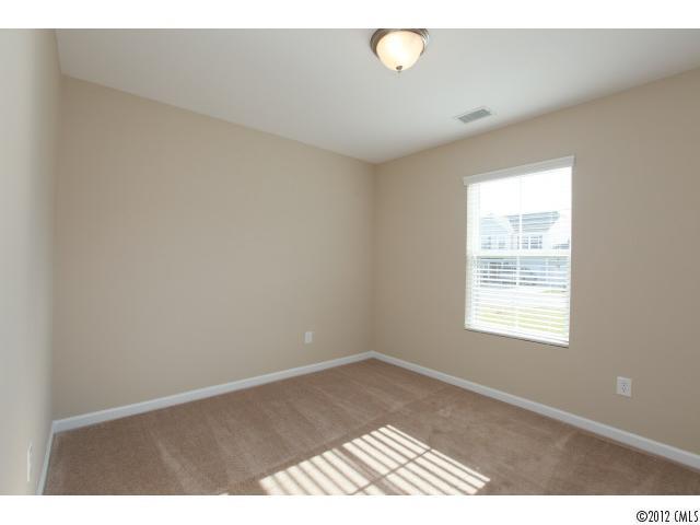 2203 Durand Road, Unit 79 Fort Mill, SC 29715 - Photo 6 of 12 a view of an empty room with a window