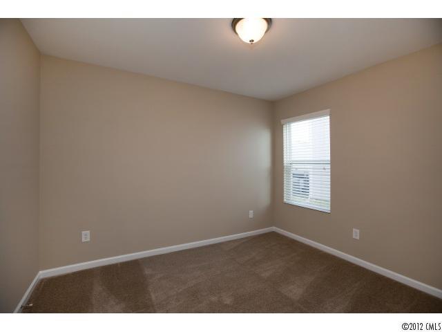 2203 Durand Road, Unit 79 Fort Mill, SC 29715 - Photo 7 of 12 a view of an empty room with a window