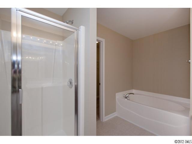 2203 Durand Road, Unit 79 Fort Mill, SC 29715 - Photo 10 of 12 a bathroom with a bathtub and shower