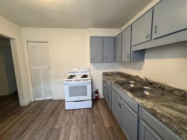 a kitchen with a stove and a sink