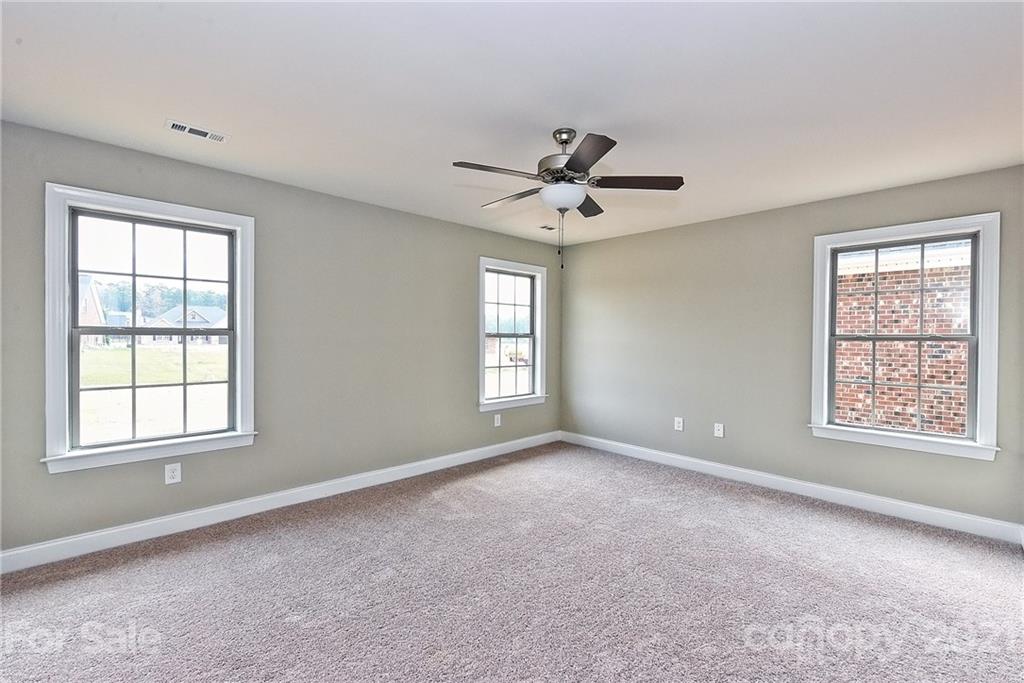 3406 Sincerity Road, Unit 3 Monroe, NC 28110 - Photo 17 of 27 a view of an empty room with a window