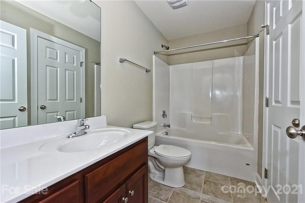3406 Sincerity Road, Unit 3 Monroe, NC 28110 - Photo 23 of 27 a bathroom with a sink toilet and shower