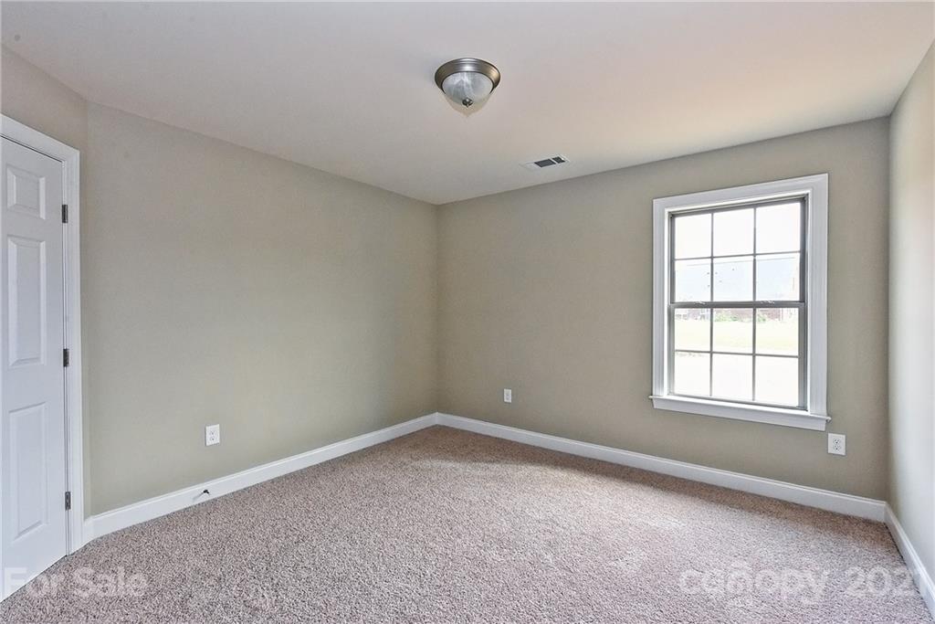 3406 Sincerity Road, Unit 3 Monroe, NC 28110 - Photo 24 of 27 an empty room with windows