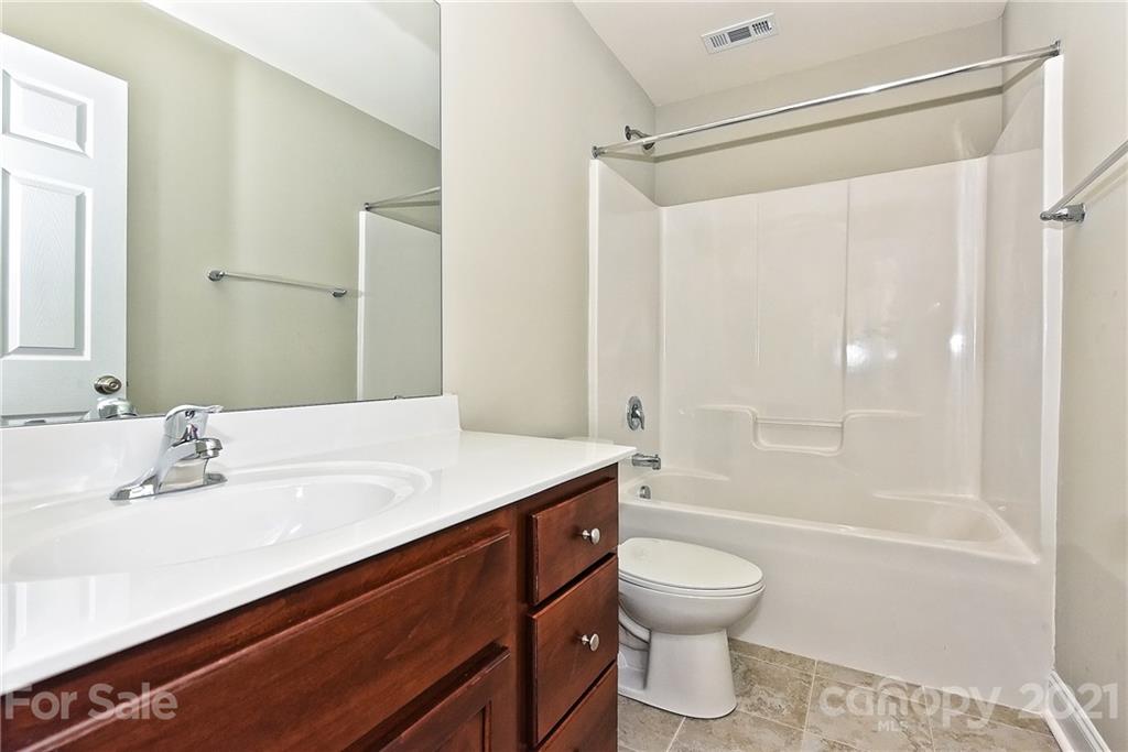 3406 Sincerity Road, Unit 3 Monroe, NC 28110 - Photo 25 of 27 a bathroom with a sink toilet tub and shower