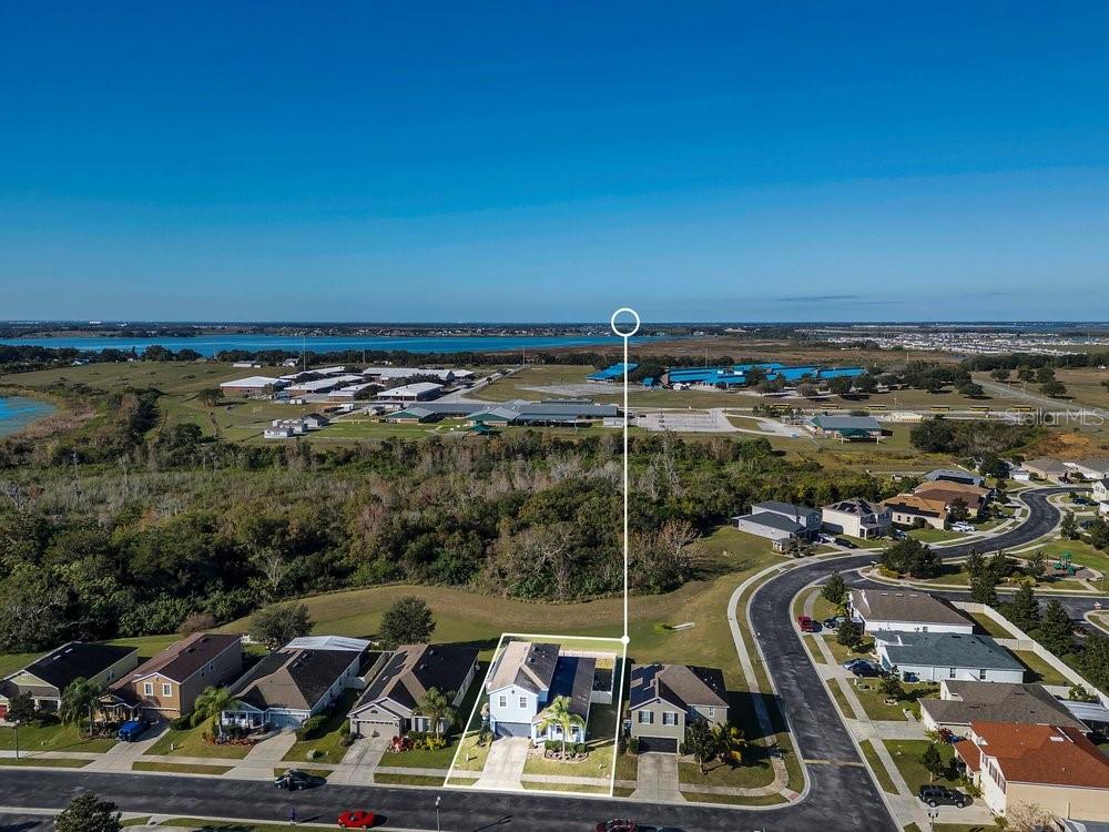 a view of a balcony with cars parked