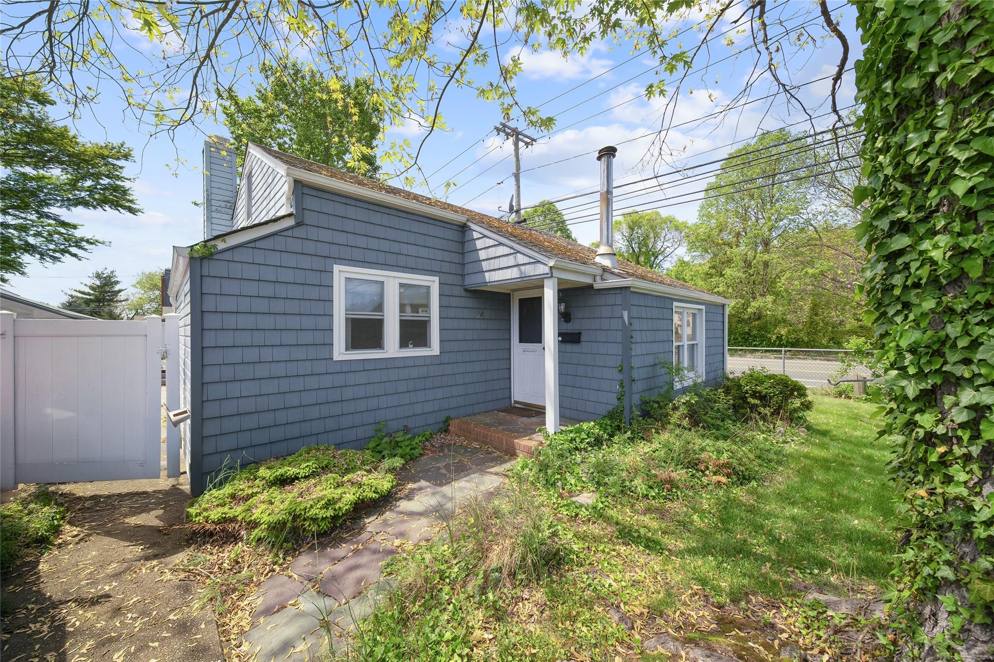 96 Pardee Avenue Islip, NY 11751 - Photo 1 of 1 a view of a backyard with plants and large tree