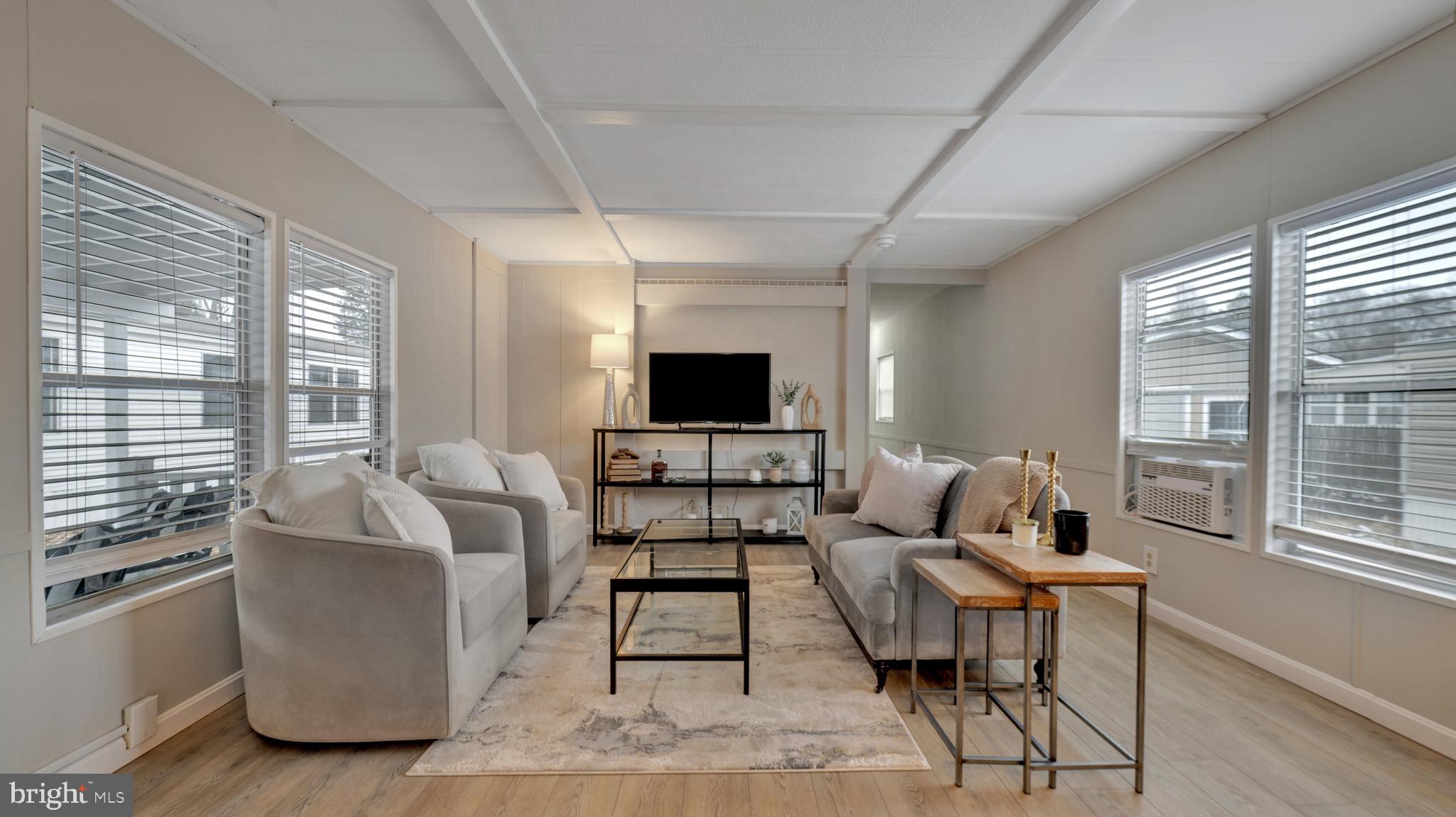 276 5th Street Lothian, MD 20711 - Photo 1 of 18 a living room with furniture and a flat screen tv