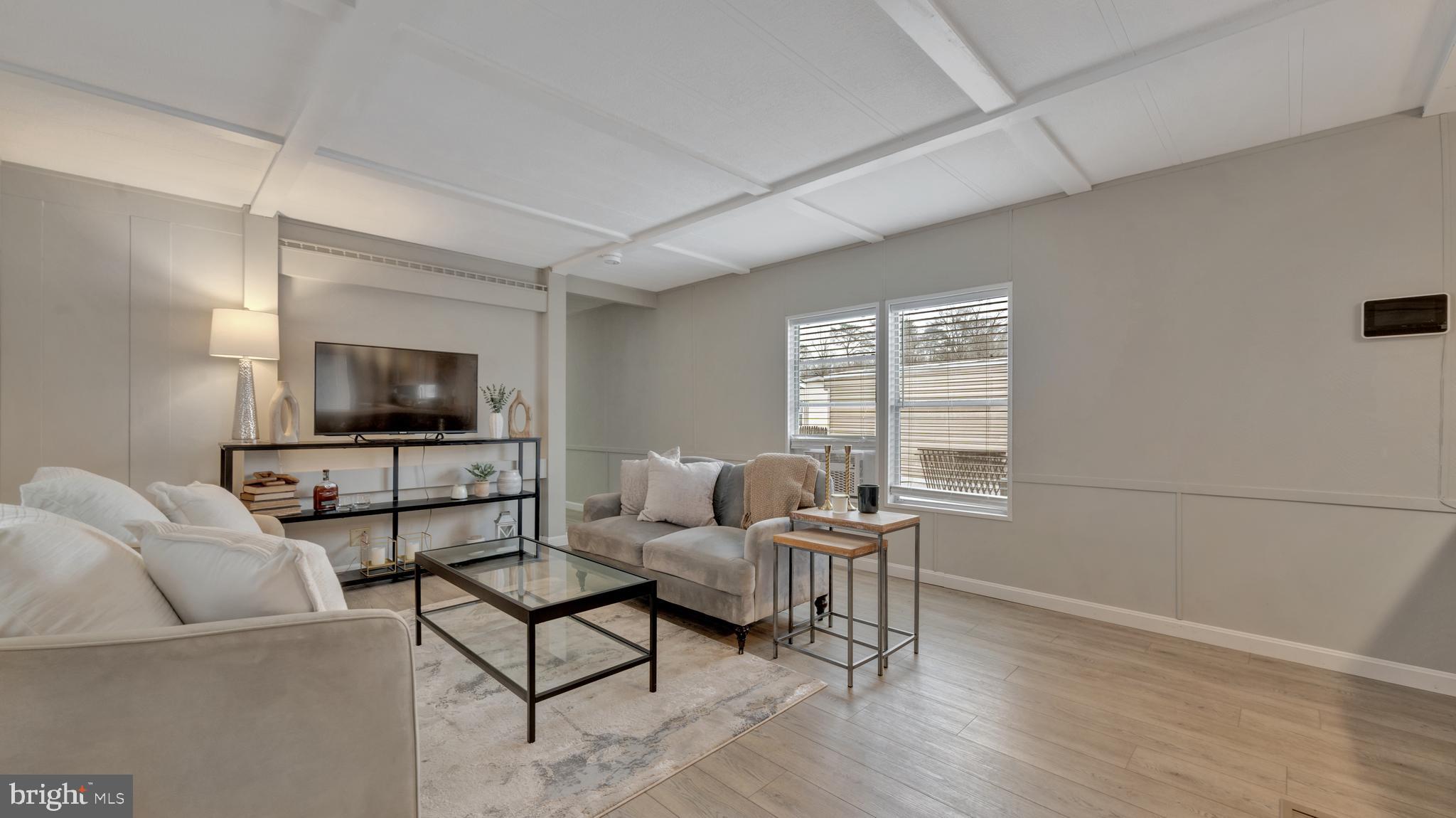 276 5th Street Lothian, MD 20711 - Photo 2 of 18 a living room with furniture and a flat screen tv