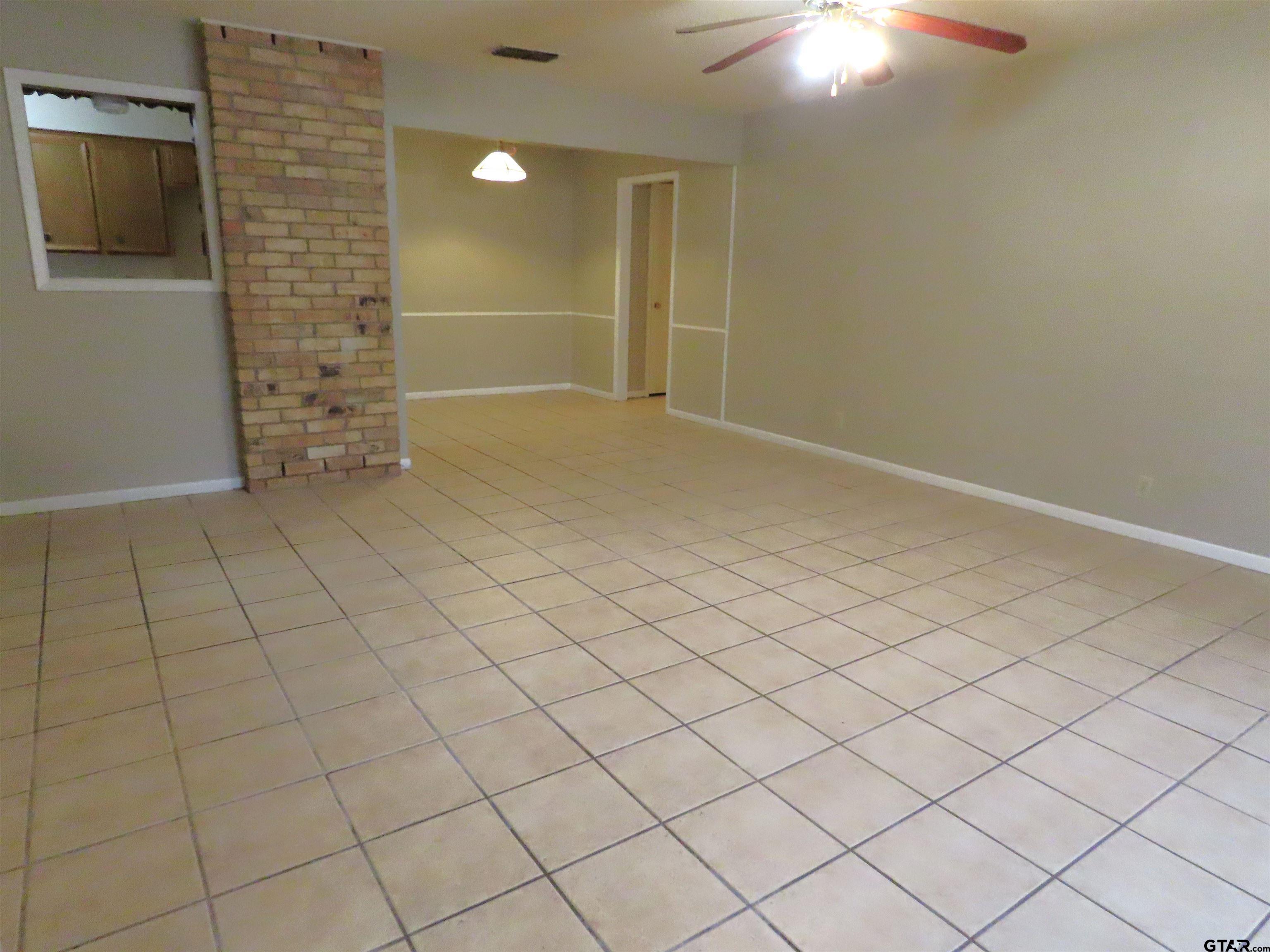 402 Muller Garden Road Tyler, TX 75703 - Photo 8 of 33 an empty room with windows