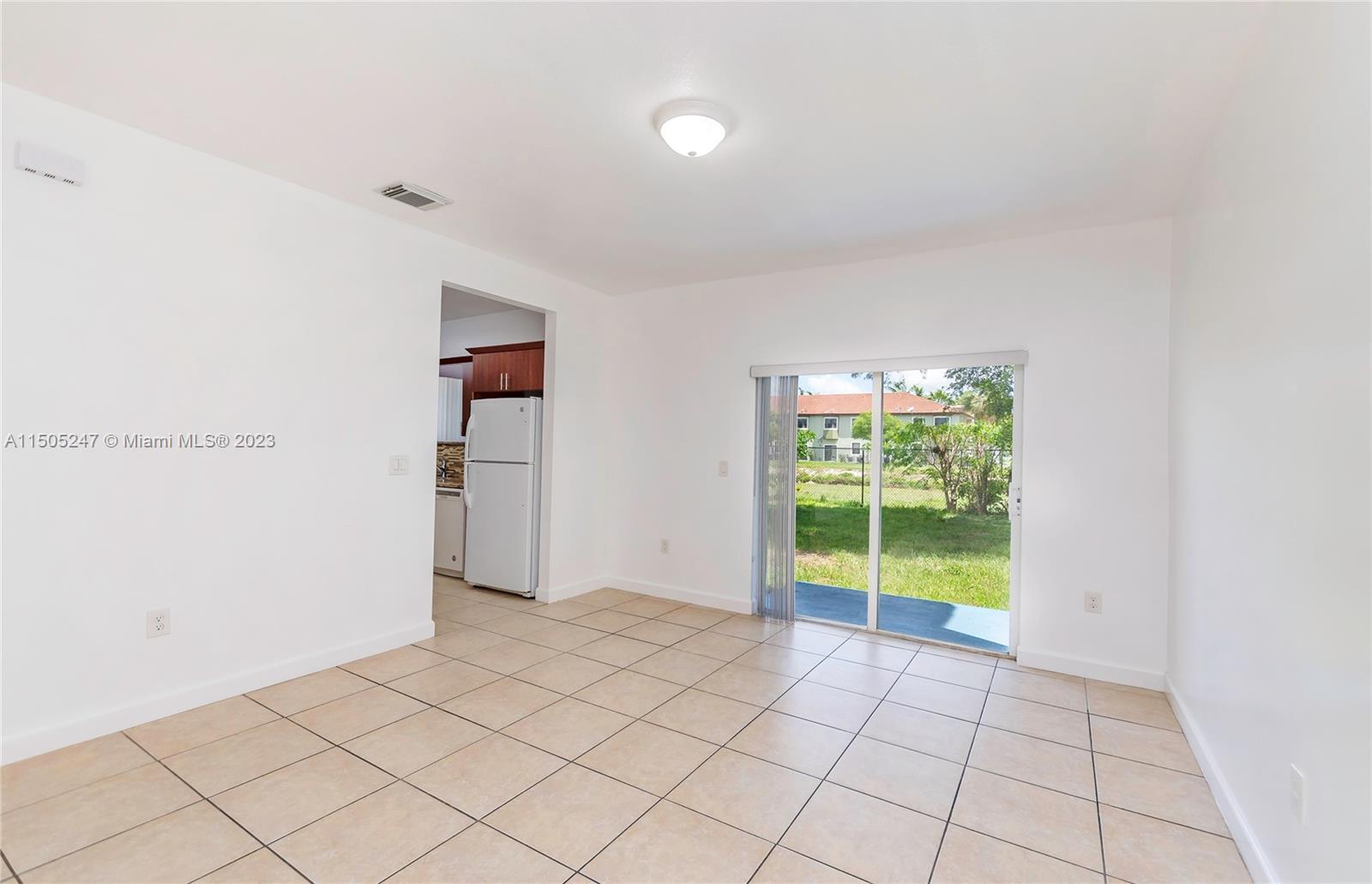 3501 Northeast 4th Street, Unit 3501 Homestead, FL 33033 - Photo 12 of 44 a view of an empty room with a window