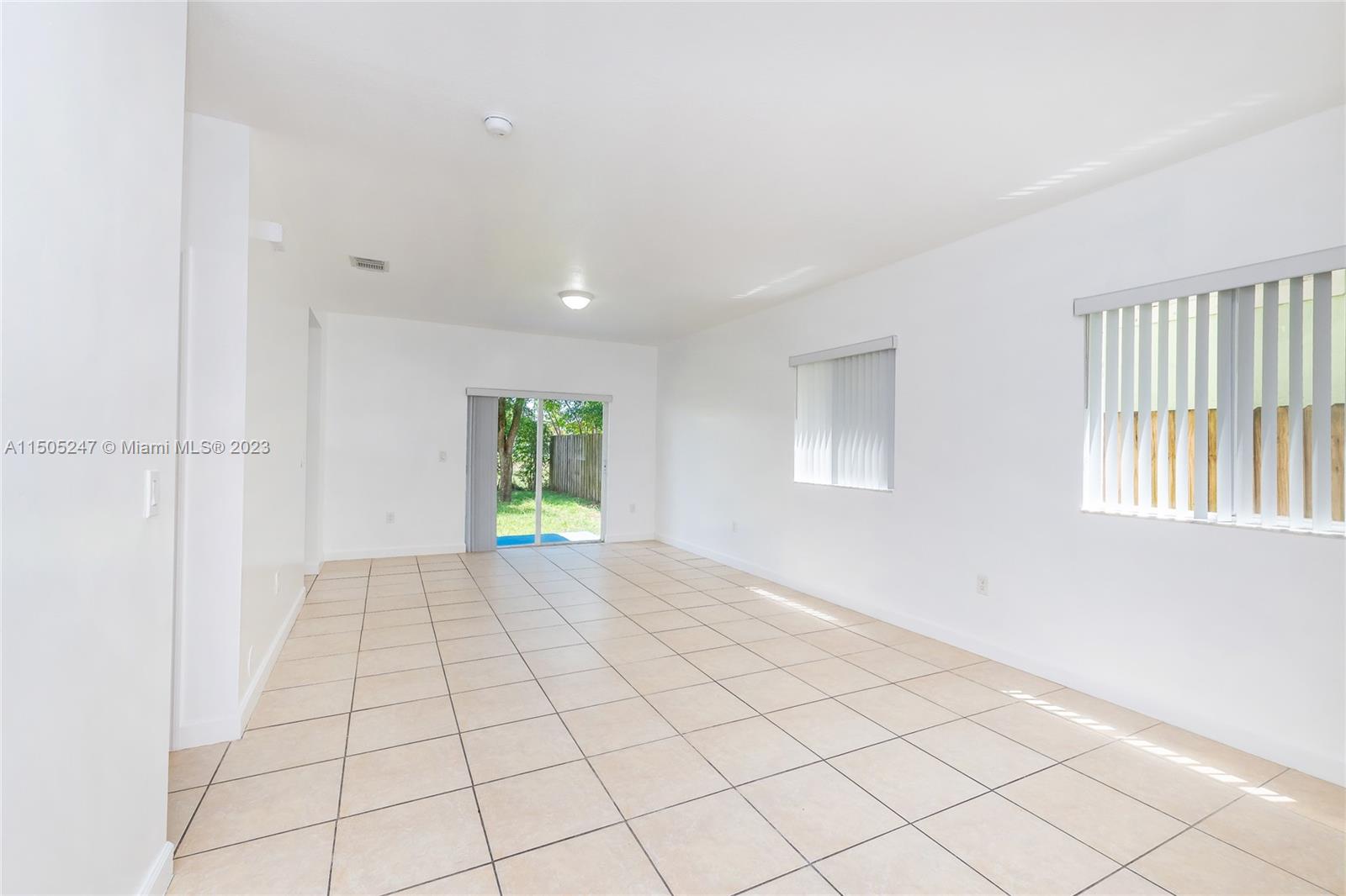 3501 Northeast 4th Street, Unit 3501 Homestead, FL 33033 - Photo 20 of 44 a view of an empty room and window