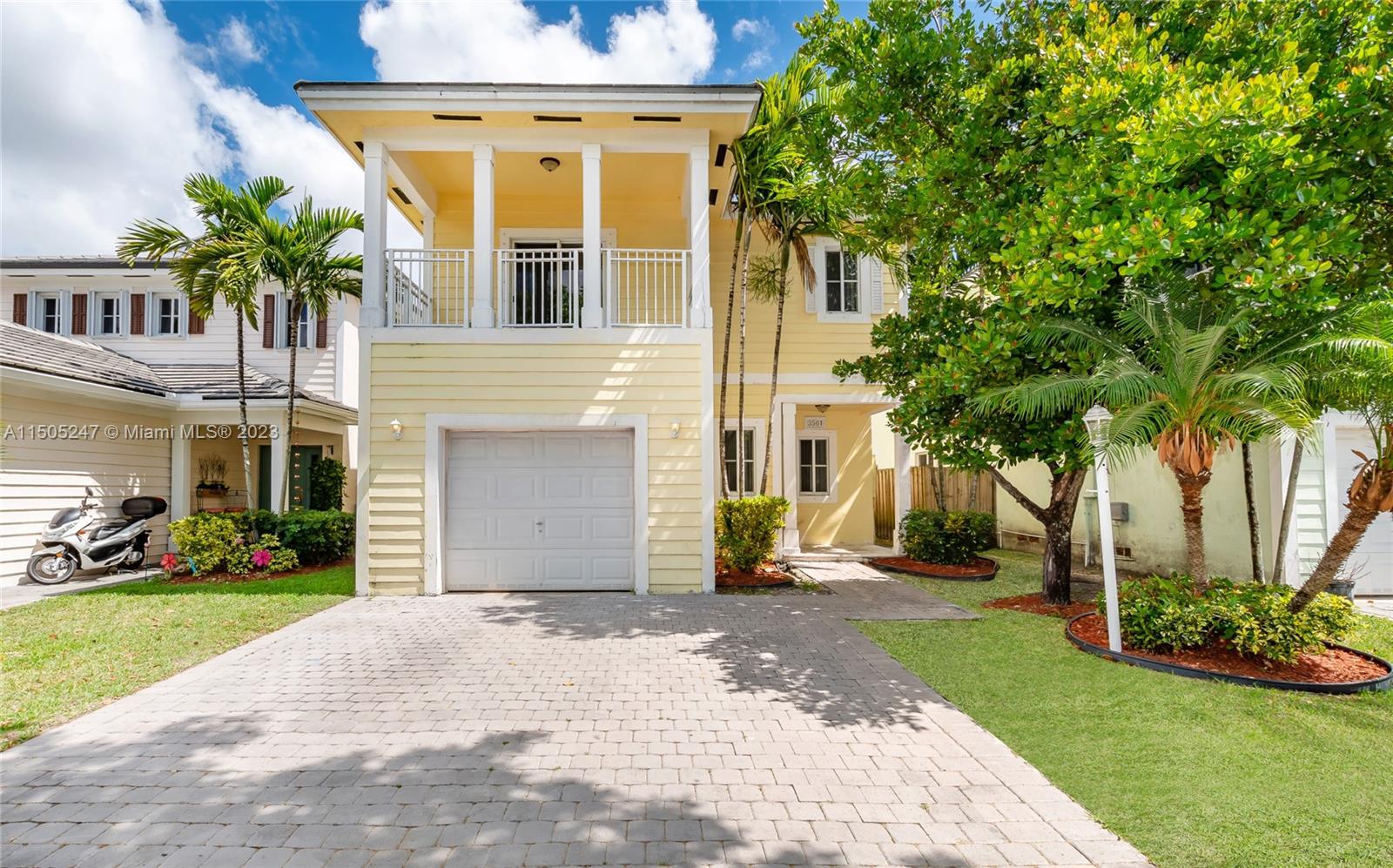 3501 Northeast 4th Street, Unit 3501 Homestead, FL 33033 - Photo 2 of 44 a front view of a house with a yard and potted plants
