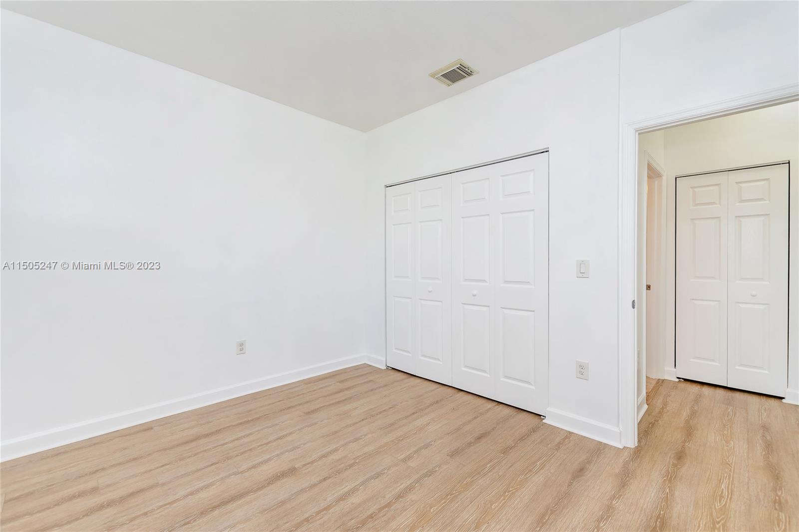 3501 Northeast 4th Street, Unit 3501 Homestead, FL 33033 - Photo 26 of 44 an empty room with wooden floor