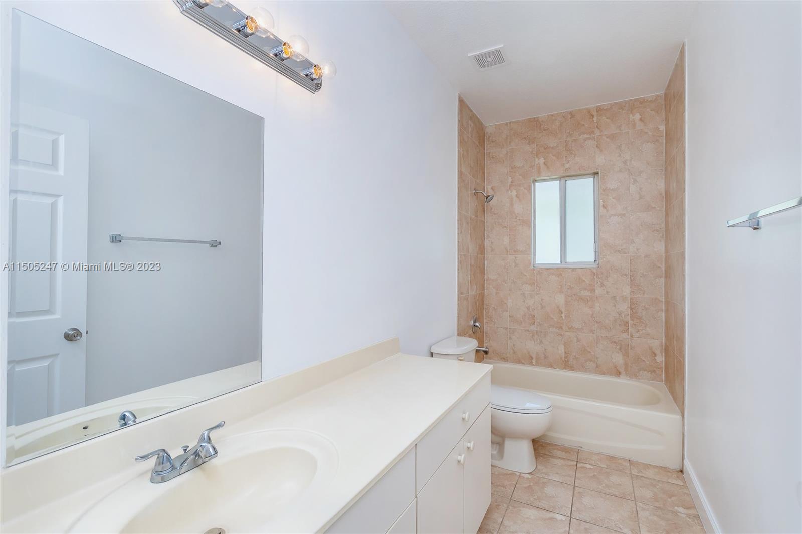 3501 Northeast 4th Street, Unit 3501 Homestead, FL 33033 - Photo 34 of 44 a bathroom with a sink a toilet and shower
