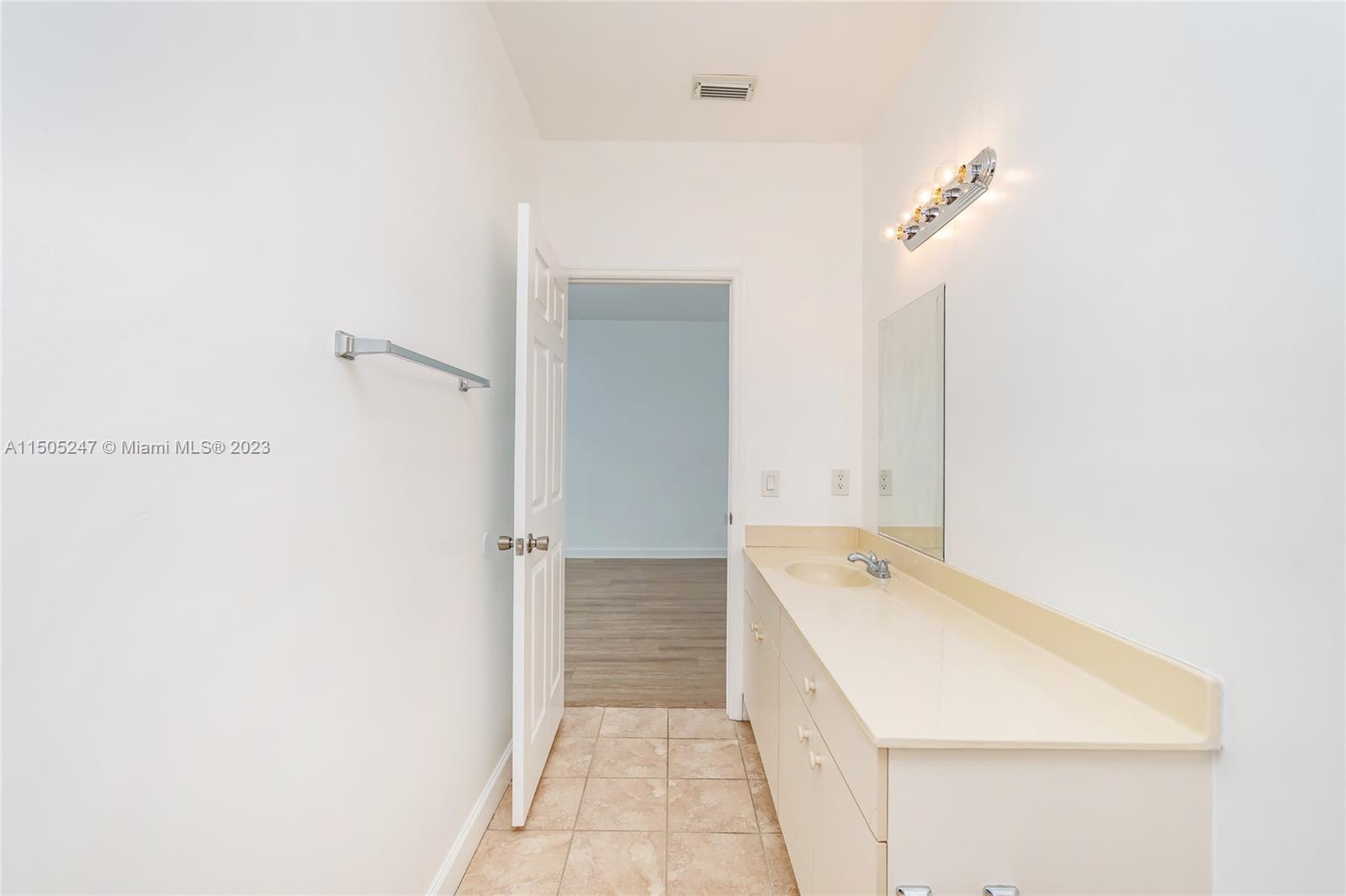 3501 Northeast 4th Street, Unit 3501 Homestead, FL 33033 - Photo 35 of 44 a bathroom with a sink and a mirror