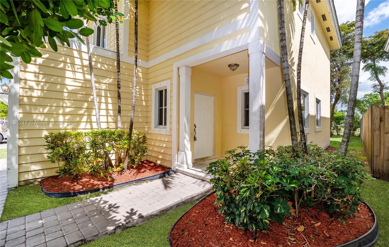3501 Northeast 4th Street, Unit 3501 Homestead, FL 33033 - Photo 4 of 44 a front view of a house with a garden