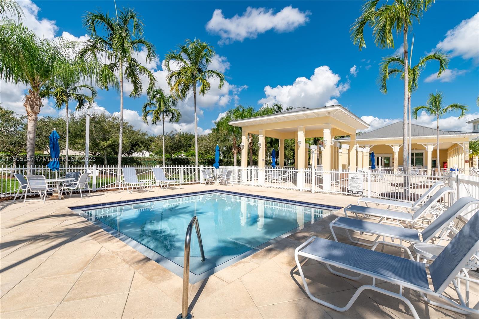 3501 Northeast 4th Street, Unit 3501 Homestead, FL 33033 - Photo 41 of 44 a view of a swimming pool with lounge chairs
