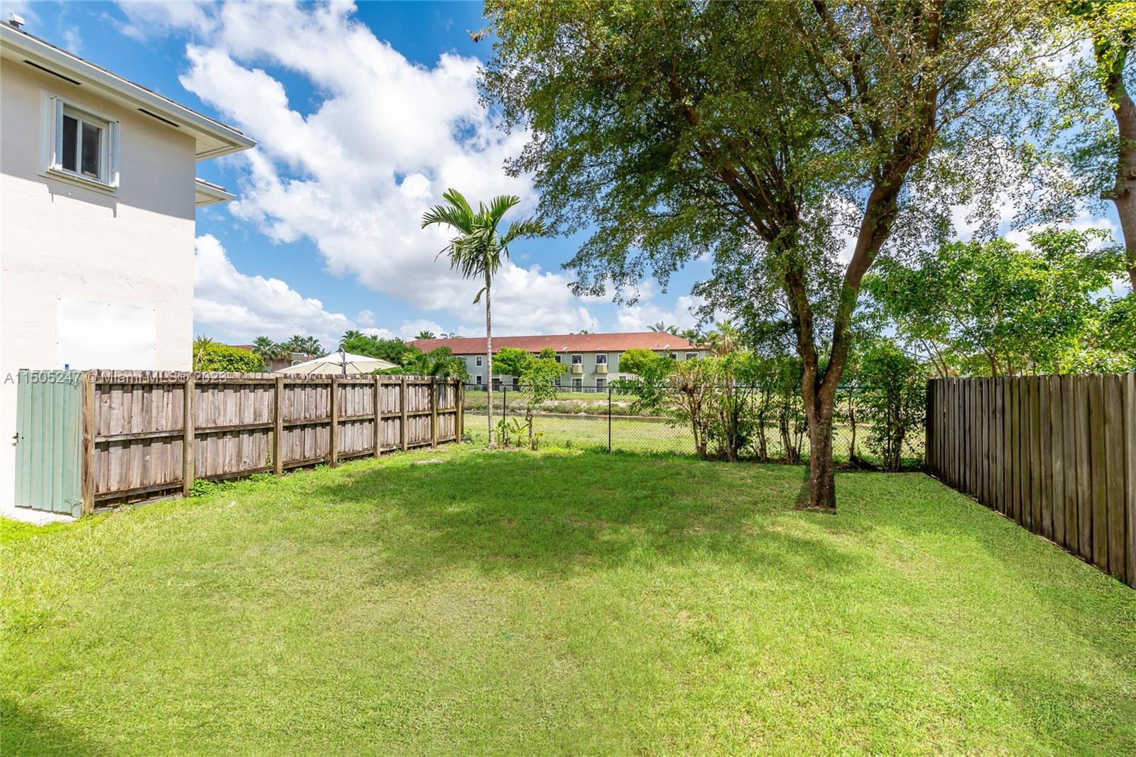 3501 Northeast 4th Street, Unit 3501 Homestead, FL 33033 - Photo 6 of 44 a view of a garden with a tree