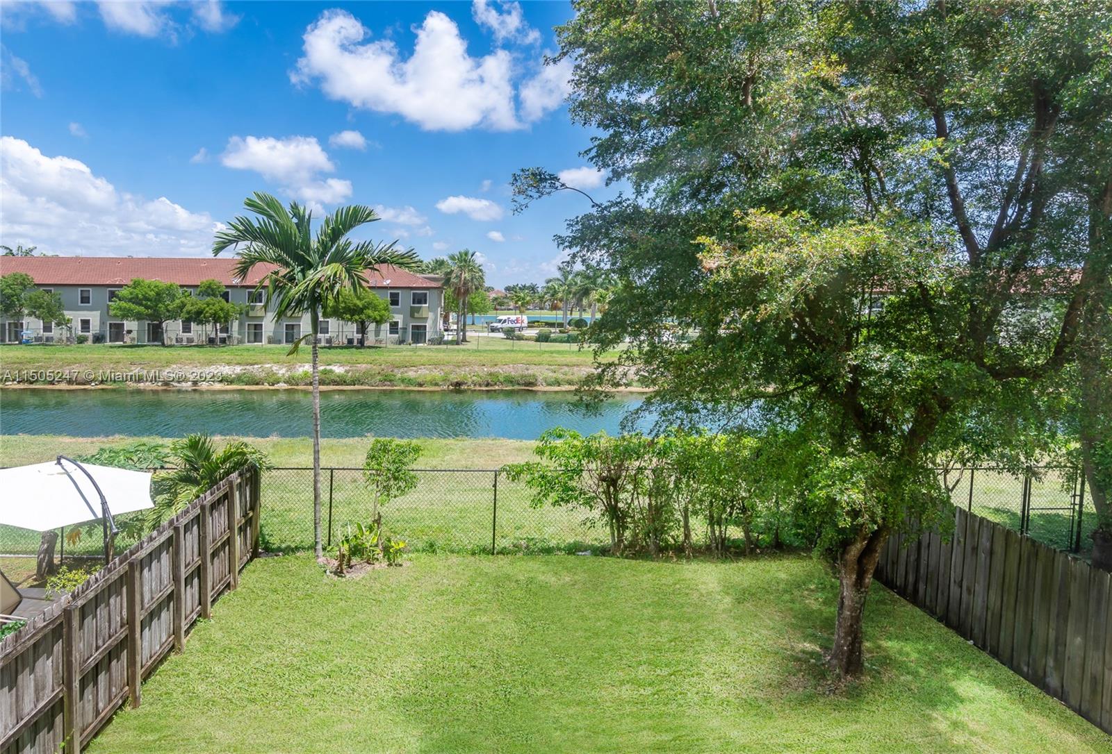 3501 Northeast 4th Street, Unit 3501 Homestead, FL 33033 - Photo 9 of 44 a view of a lake with a garden