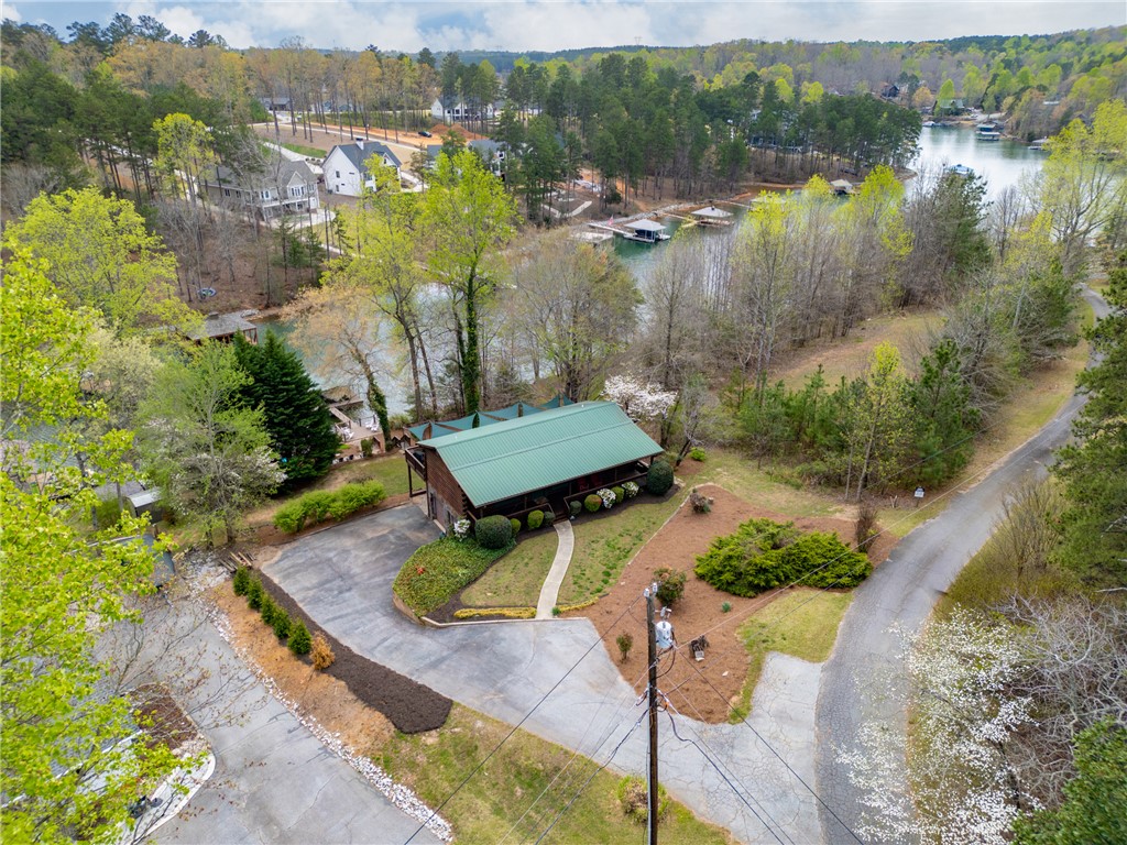 203 Little Lane Seneca, SC 29672 - Photo 41 of 48 This tranquil lakeside residence offers direct water access and verdant surroundings, perfect for serene living.