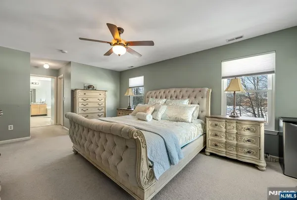 a bed room with a bed and a window