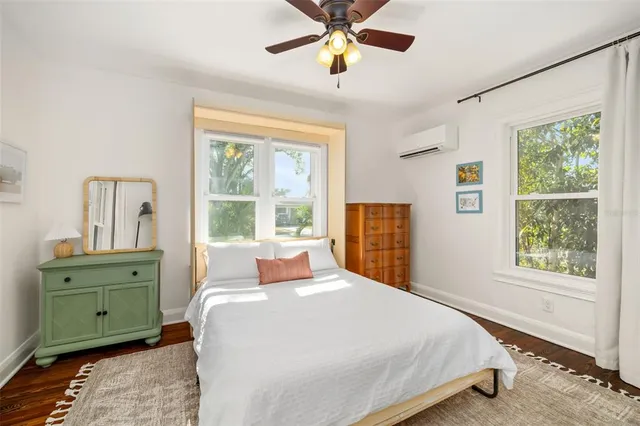 a bedroom with a bed and window