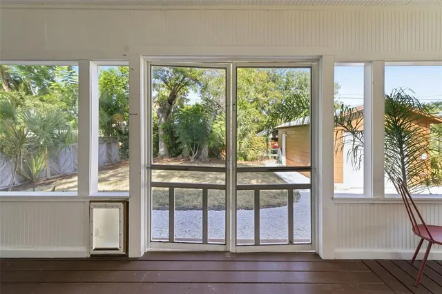 a view of a livingroom with furniture window and wooden floor