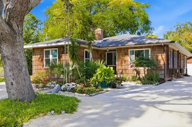 a view of a house with a garden