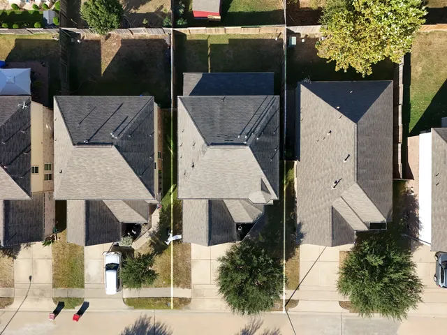 an aerial view of a house with a outdoor space