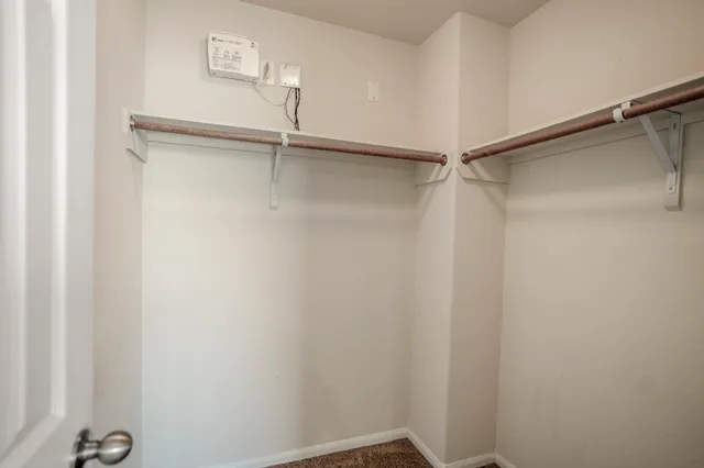 a view of an empty walk in closet