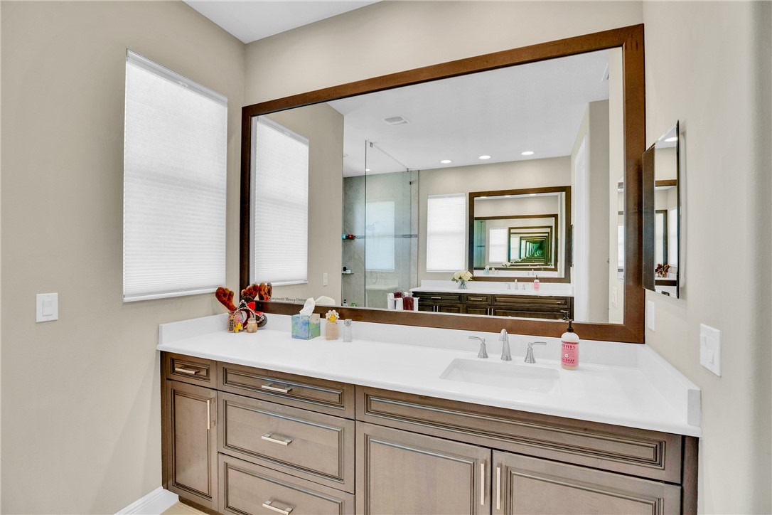 105 Night Hawk Way Sebastian, FL 32958 - Photo 17 of 36 a bathroom with a sink and a mirror
