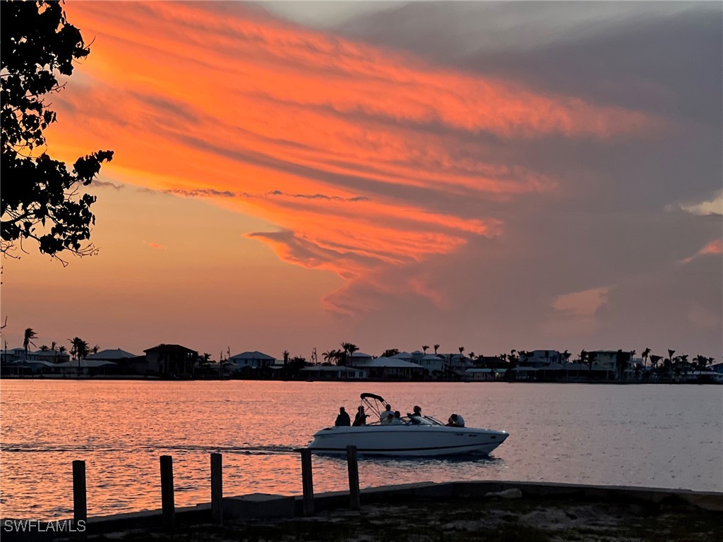 11458 May Street, Unit 1 Matlacha, FL 33993 - Photo 18 of 18 a view of a lake with a mountain view