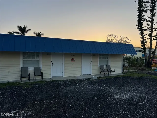 a kitchen with refrigerator and cabinets